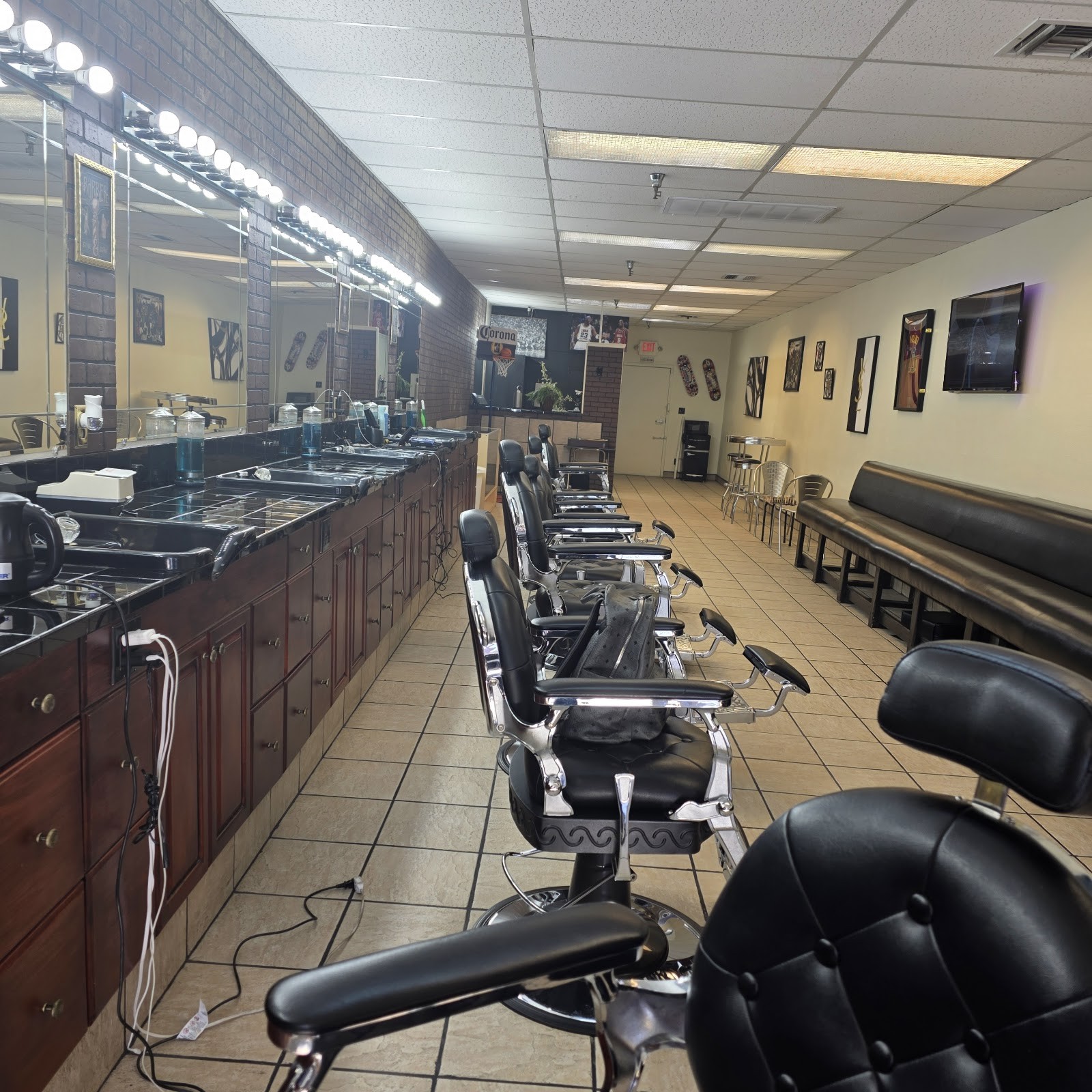 Interior of 219 Barber Lounge with a row of classic barber chairs and lit mirrors